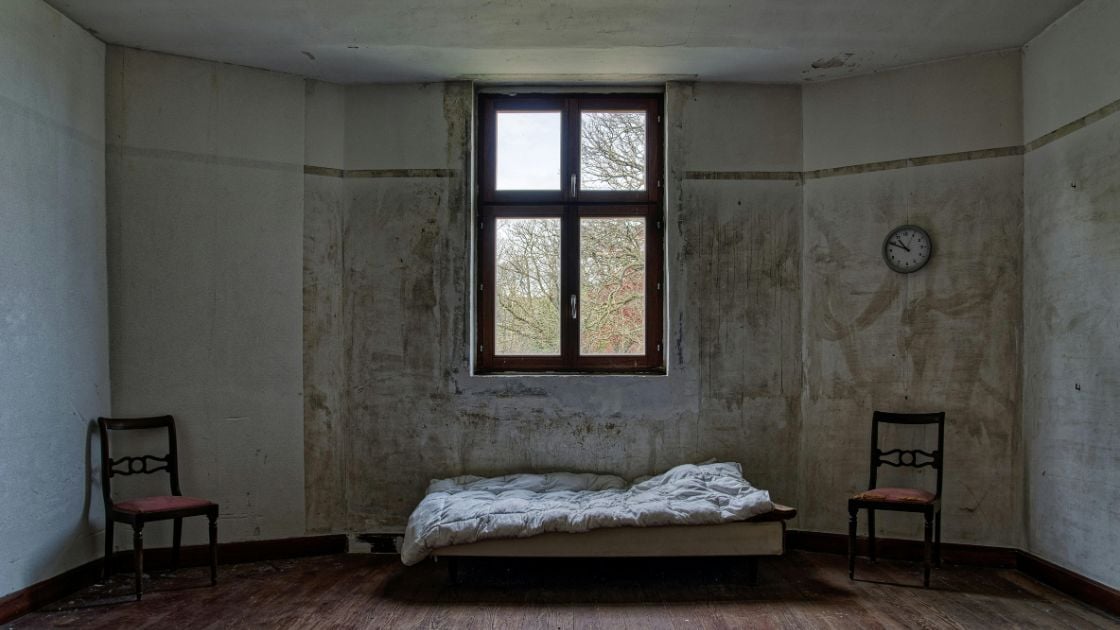 Old room with a single window bringing natural light into the interior