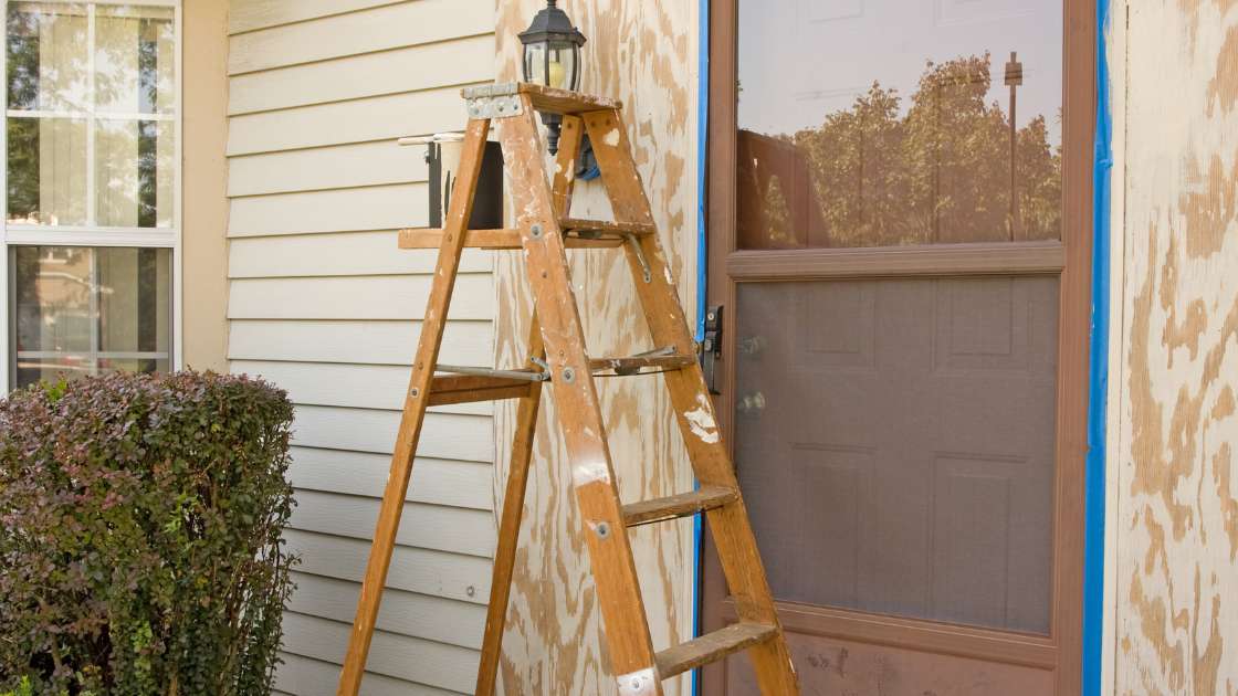 Homeowner checking windows before summer heat in El Paso